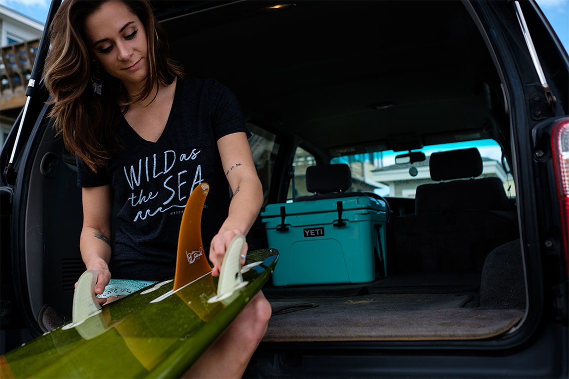 Kitty Hawk Surf Co. Surfboard and Yeti cooler